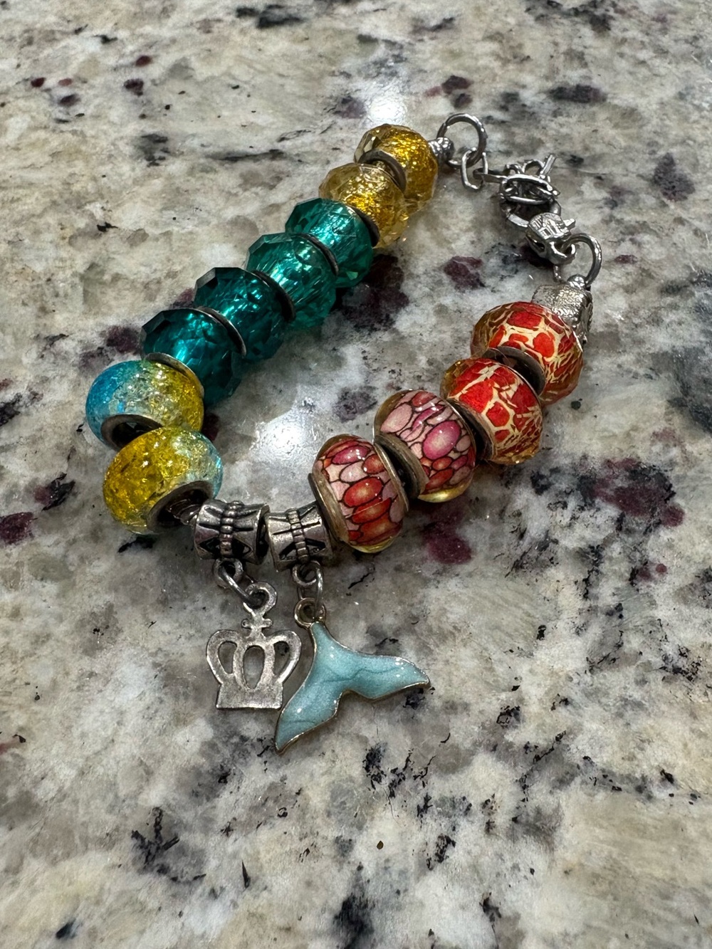Unbranded silver tone charm bracelet with minor tarnish and wear